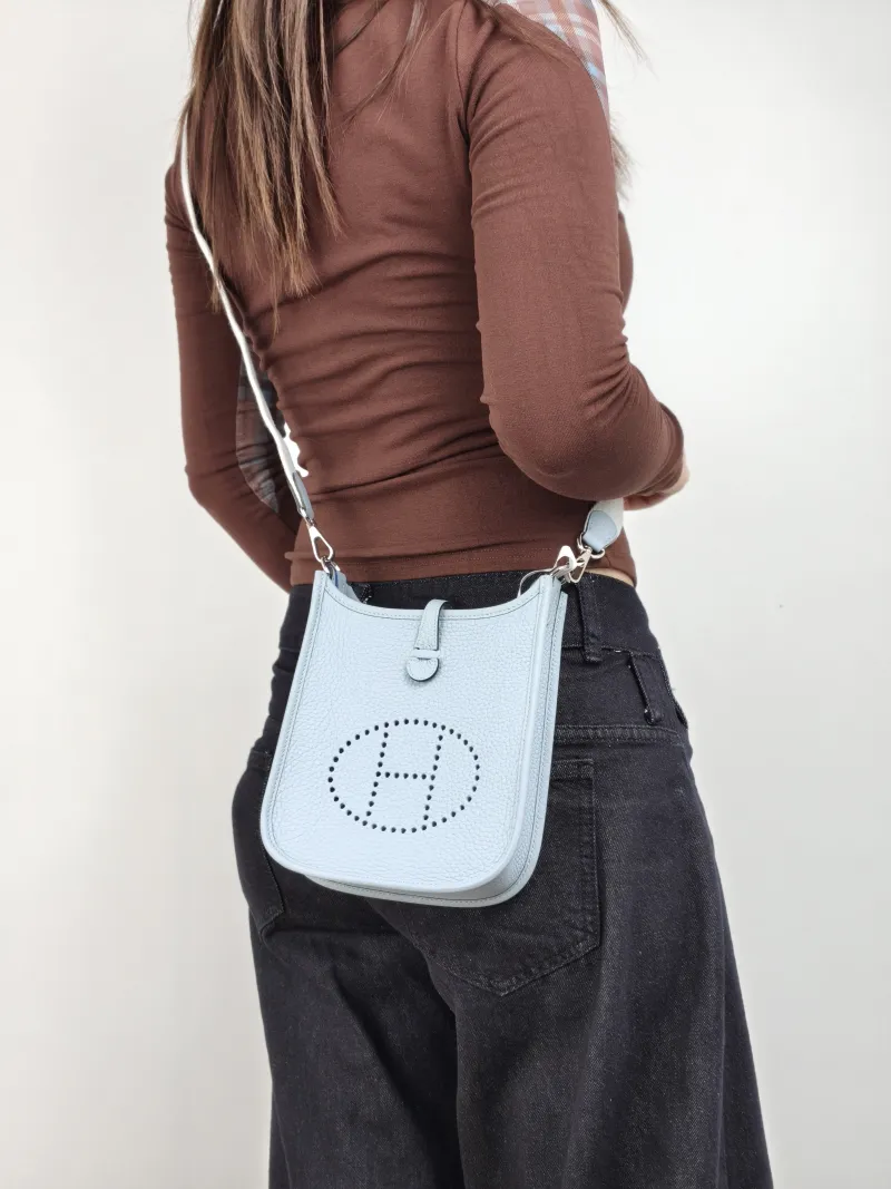 Hermès Crossbody Bag Evelyne Mini 16 Mini 16 J7 Taurillon Clemence TC Calfskin Mini 17 × 5.5 × 18 cm K — on-model view 1 of 2