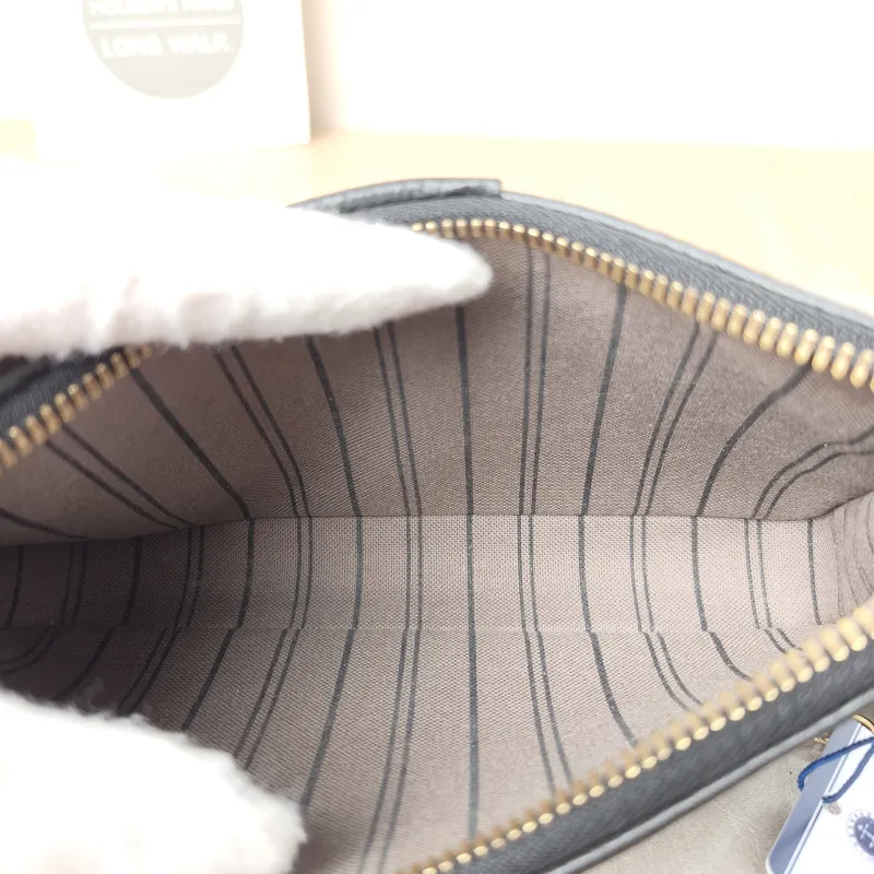 Louis Vuitton Crossbody Bag EASY POUCH ON STRAP Black Monogram Empreinte Embossed Calfskin Mini 19 × 3 × 11.5 cm — detail view 10 of 10