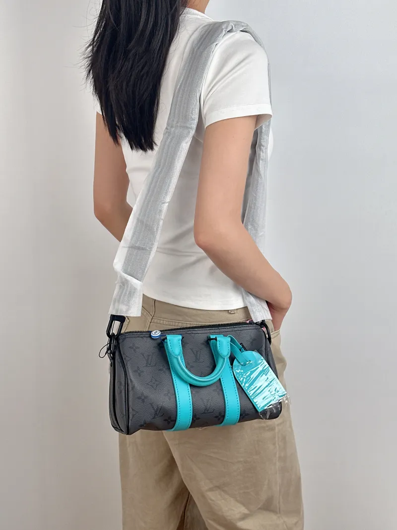 Louis Vuitton Crossbody Bag Keepall 25 Black · Blue PVC Medium 25 × 11 × 15 cm — on-model view 2 of 3