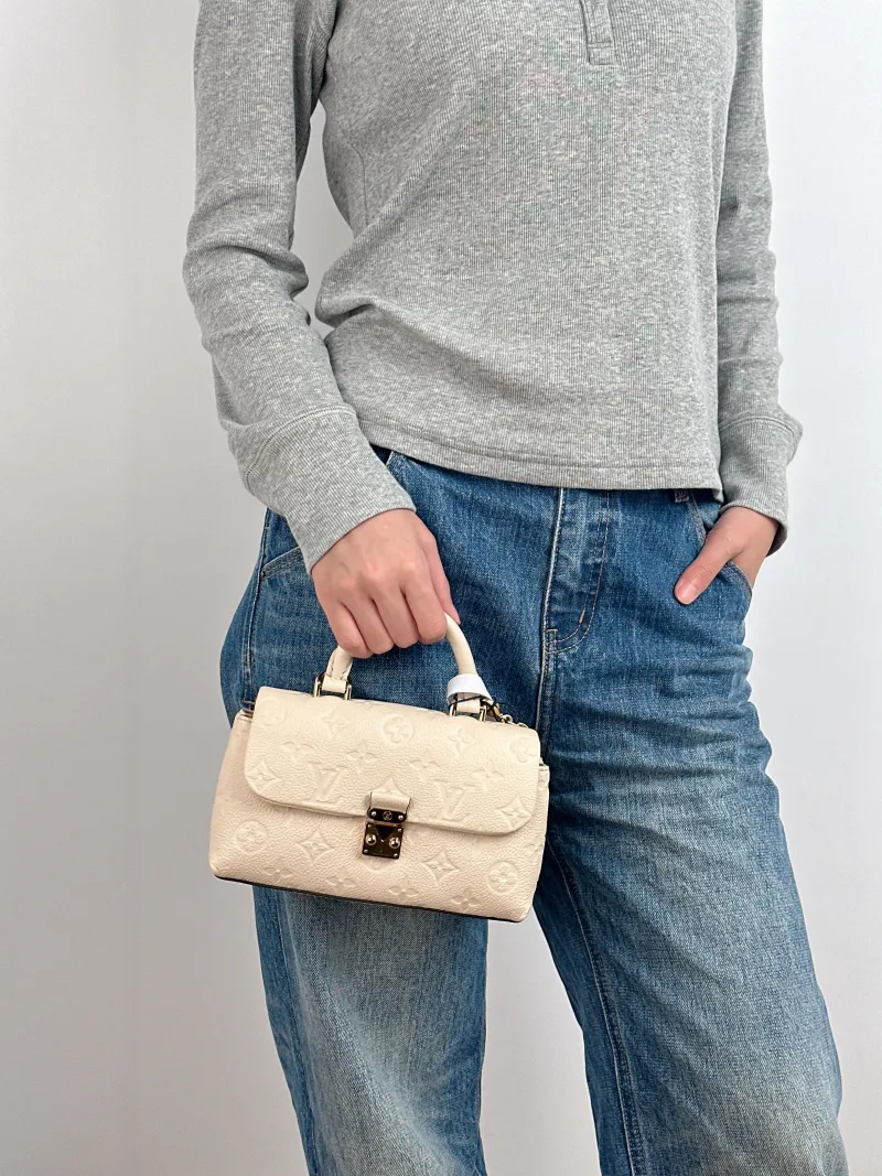 Louis Vuitton Crossbody Bag MADELEINE White Empreinte Embossed Calfskin nano 21 × 6 × 12.5 cm — on-model view 2 of 3