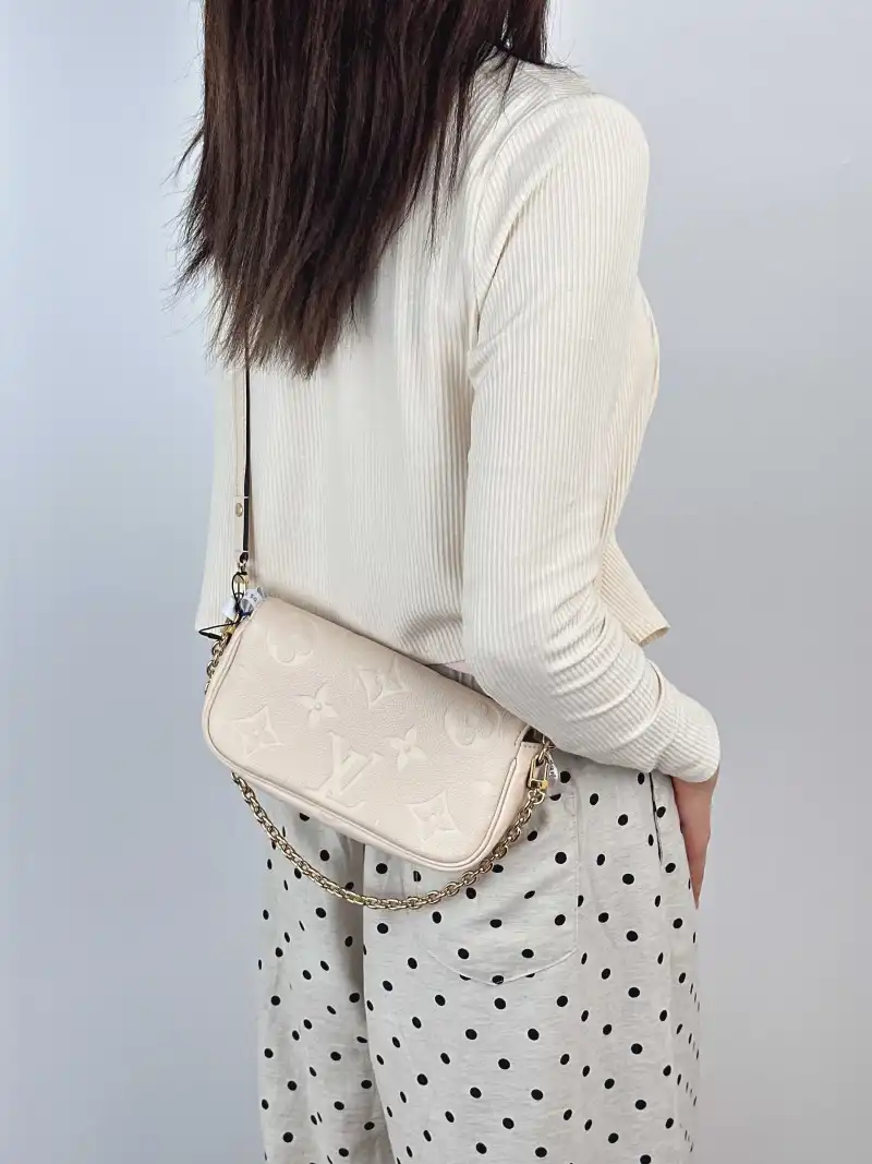 Louis Vuitton Crossbody Bag IVY White Monogram Empreinte Embossed Calfskin Small 23.5 × 4.3 × 12 cm — on-model view 2 of 2