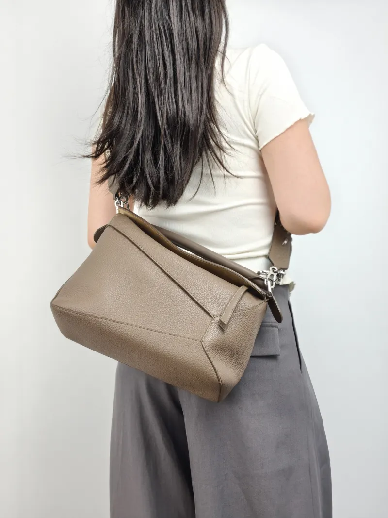 LOEWE Crossbody Bag Puzzle Brown Calfskin Medium 29 × 14 × 19.5 cm — on-model view 1 of 3