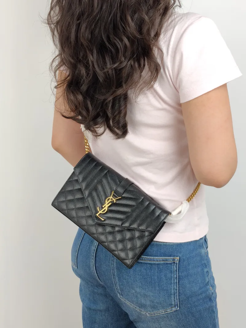 SAINT LAURENT Crossbody Bag ENVELOPE Black Grained Calfskin Small 21 × 6 × 13 cm — on-model view 2 of 2
