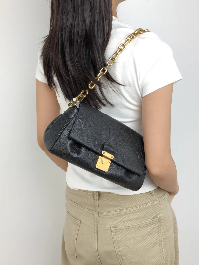 Louis Vuitton Crossbody Bag Favorite Black Monogram Empreinte Embossed Calfskin Medium 24 × 9 × 14 cm — on-model view 1 of 3