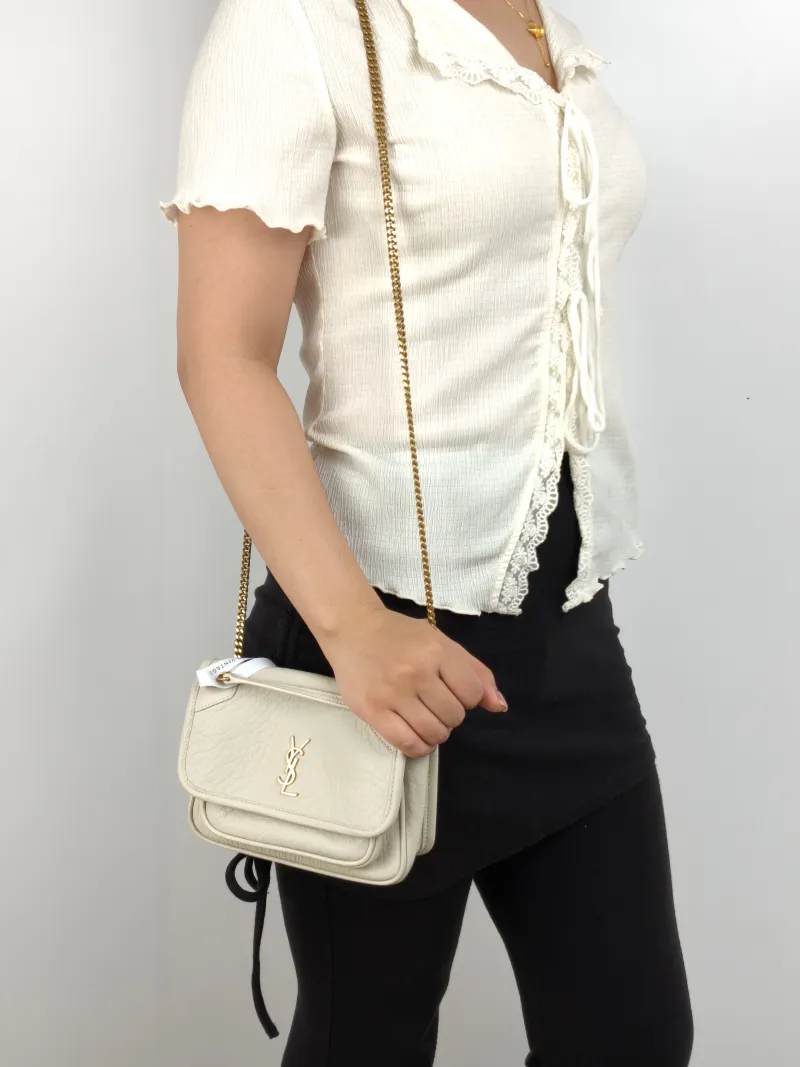 SAINT LAURENT Crossbody Bag Niki White Lambskin Mini 18 × 5 × 12.5 cm — on-model view 1 of 3