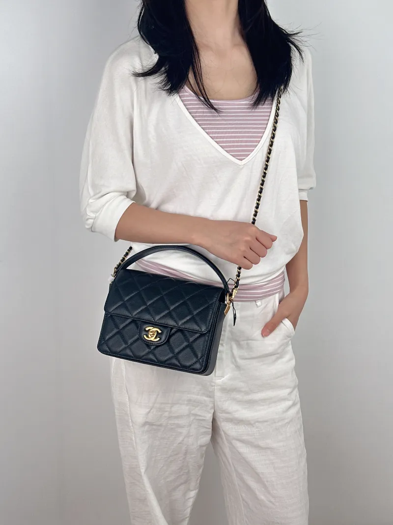 Chanel Crossbody Bag Black with Gold-Tone Hardware Grained Calfskin Small 20 × 5 × 15 cm — on-model view 3 of 3