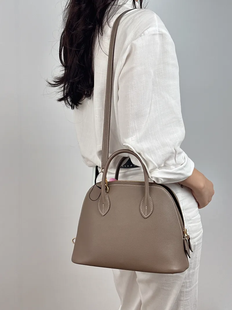 Hermès Shoulder Bag Bolide 1923 25Gold-Tone Hardware Top Handle Bag Evercolor Calfskin Small 25 × 11 × 20 cm B — on-model view 2 of 2