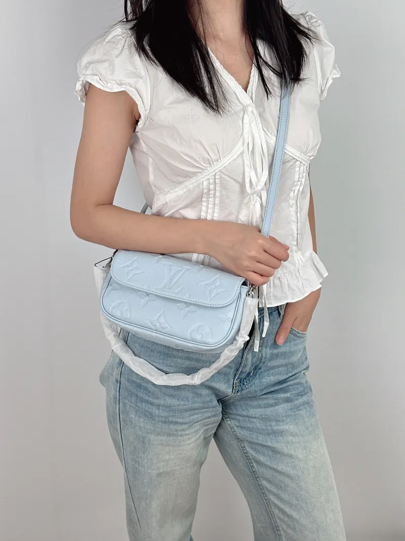 Louis Vuitton Crossbody Bag IVY Blue Empreinte Embossed Calfskin Small 23.5 × 4.3 × 12 cm — on-model view 2 of 3