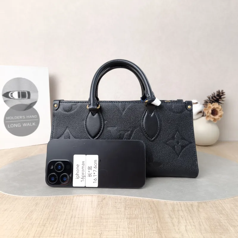 Louis Vuitton Crossbody Bag Onthego East West Two Straps Black Monogram Empreinte Embossed Calfskin Small 25 × 10 × 13 cm — cover view 4 of 6