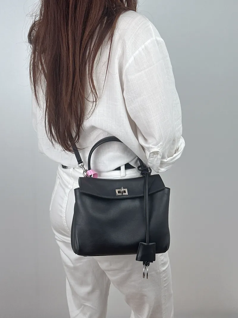 BALENCIAGA Crossbody Bag RODEO Black CC alfskin Mini 23 × 10 × 17 cm — on-model view 1 of 2