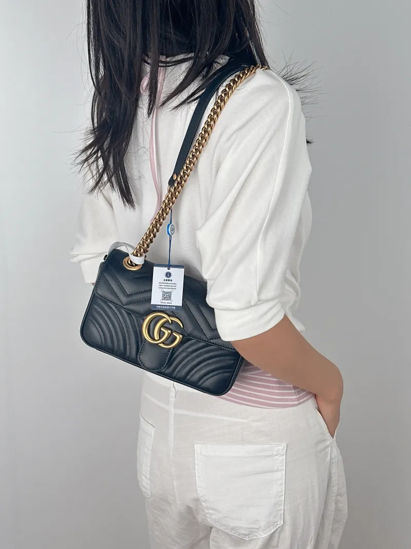 GUCCI Crossbody Bag GG Marmont Small Marmont 22Black CC alfskin Small22 × 6 × 13 cm — on-model view 1 of 2