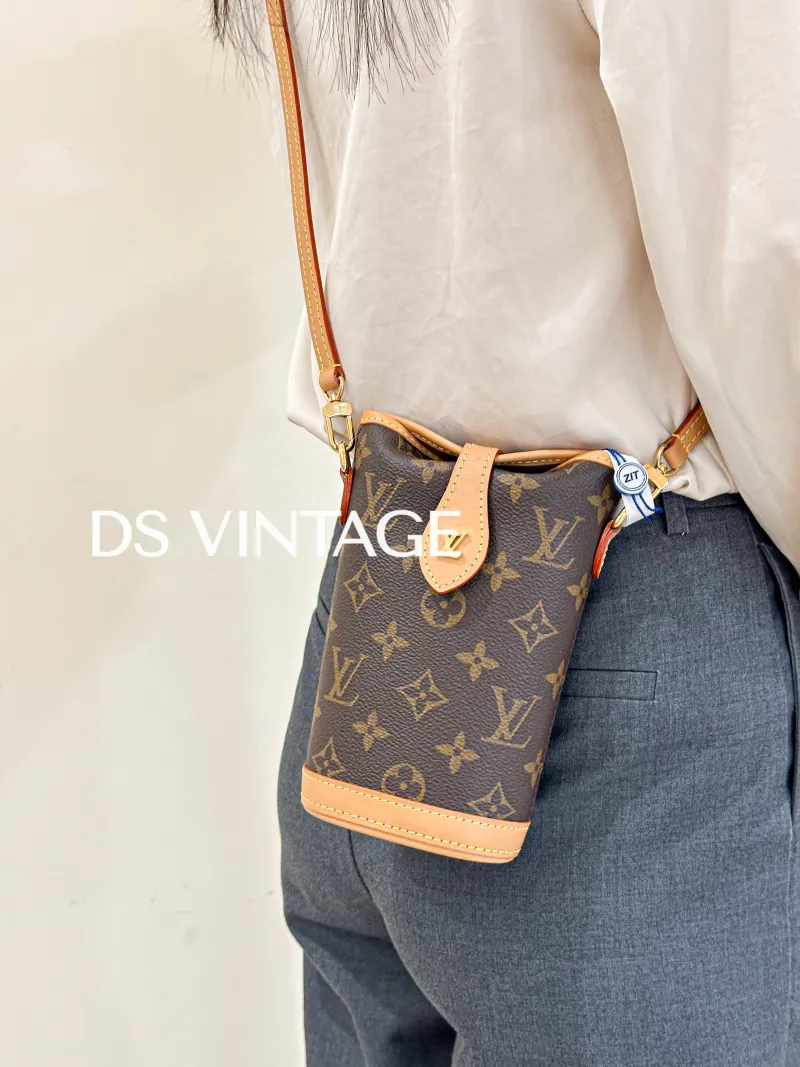 Louis Vuitton Crossbody Bag Fold Me Monogram PV Cmini14.5 × 6.5 × 18 cm — on-model view 2 of 3