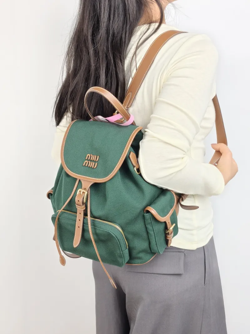 Miumiu Backpack Backpack Green Canvas Large 25 × 12.5 × 29.5 cm — on-model view 1 of 2