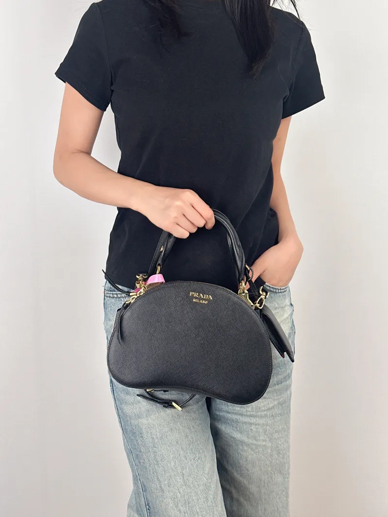 PRADA Shoulder Bag Black Calfskin One Size25 × 8 × 16 cm — on-model view 2 of 3
