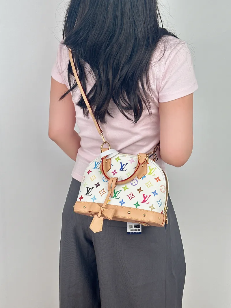 Louis Vuitton Crossbody Bag Alma BB Multicolore PVCBB23.5 × 11.5 × 17.5 cm — on-model view 2 of 2