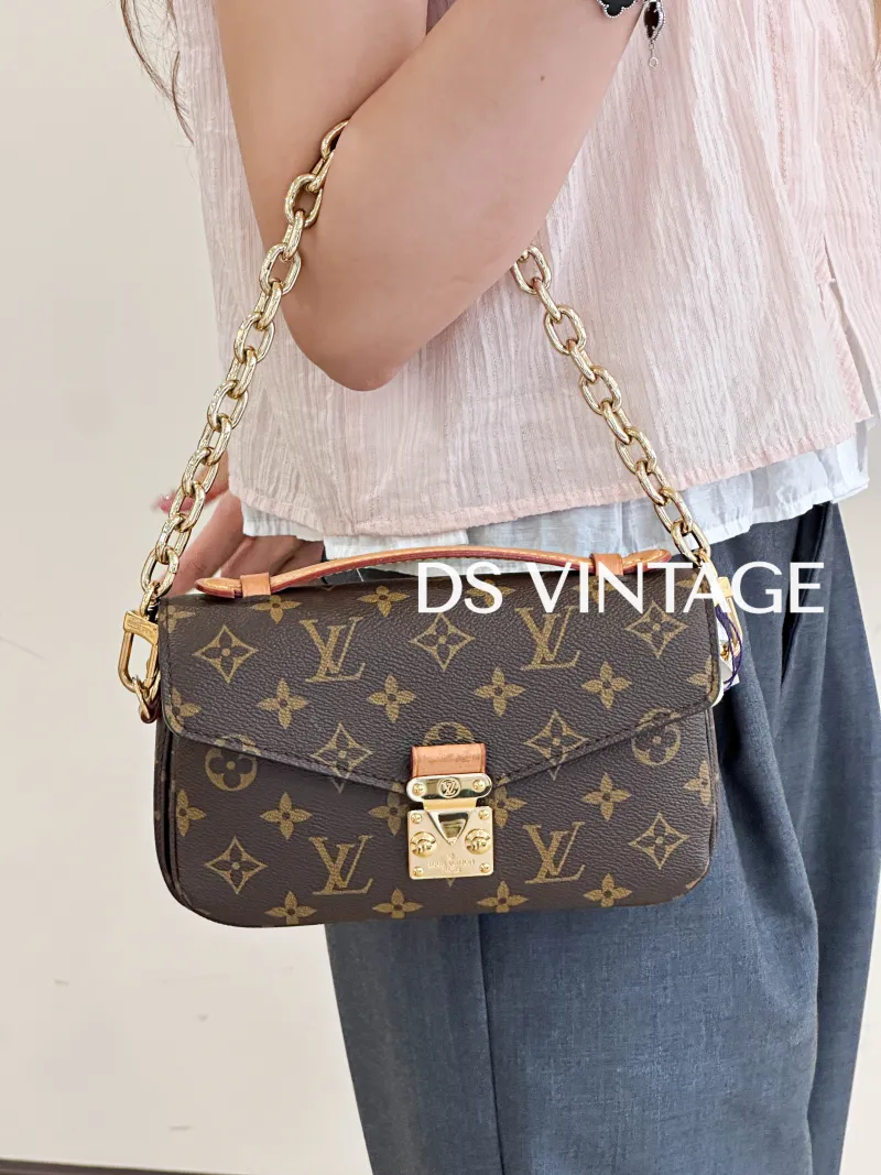 Louis Vuitton Crossbody Bag Pochette Métis East West Monogram PVC Small21.5 × 6 × 13.5 cm — on-model view 1 of 3