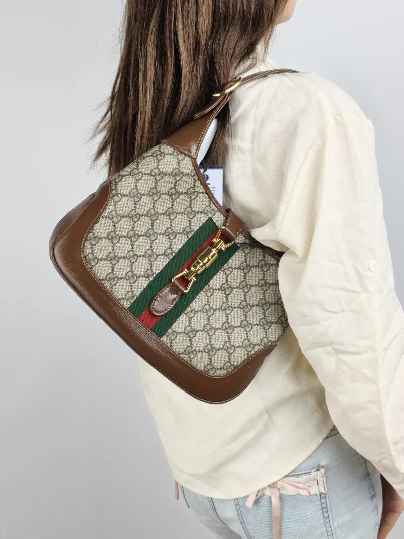 GUCCI Shoulder Bag Jackie 1961Collection Monogram PVC Medium 27.5 × 4 × 19 cm — on-model view 1 of 3