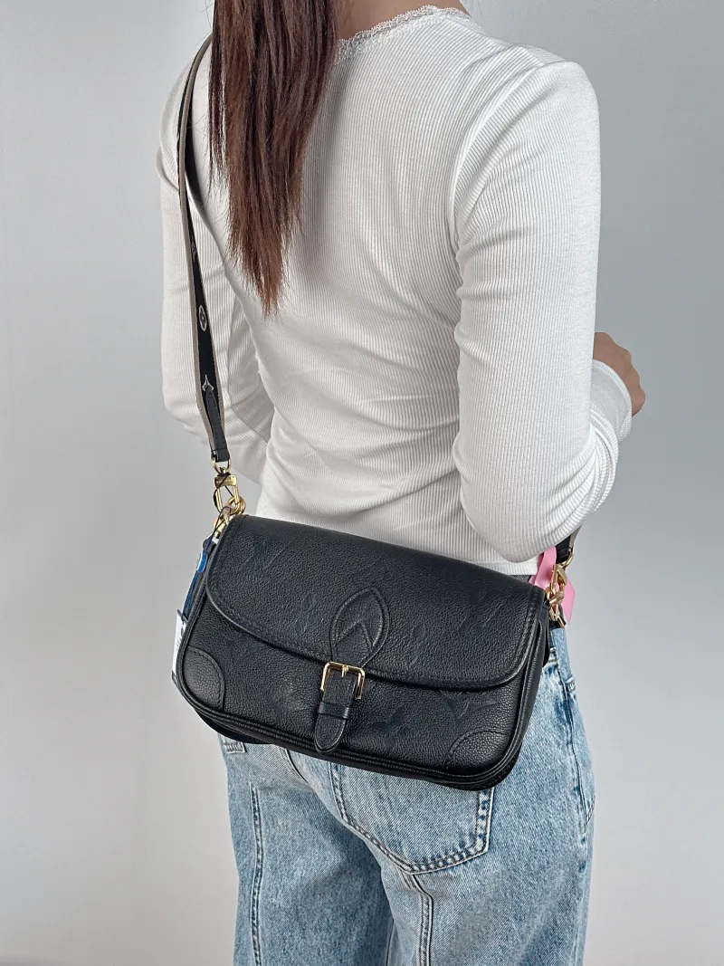Louis Vuitton Crossbody Bag Diane Baguette Bag Black Monogram Empreinte Embossed Calfskin Small 24 × 9 × 15 cm — on-model view 1 of 3