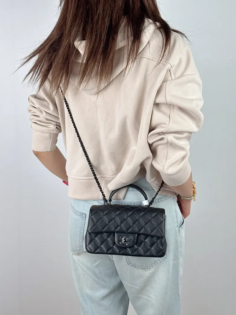 Chanel Crossbody Bag mini Black Lambskin mini 20 × 6 × 12 cm — on-model view 3 of 3
