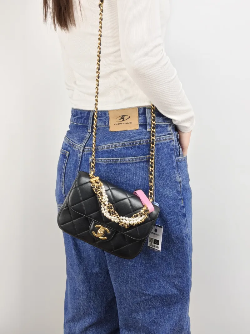 Chanel Crossbody Bag Pearl Black Lambskin Small 19 × 6 × 14 cm — on-model view 2 of 3