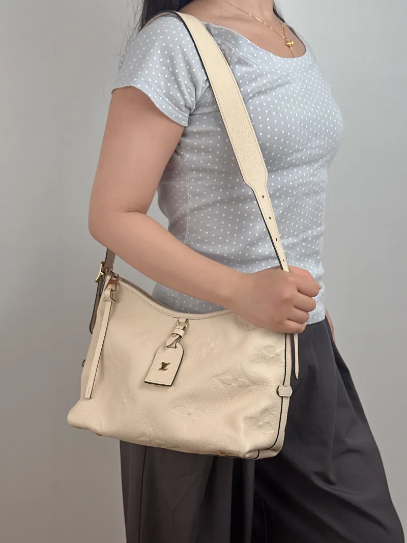 Louis Vuitton Crossbody Bag Carryall White Calfskin Small 29.5 × 12 × 24 cm — on-model view 2 of 2