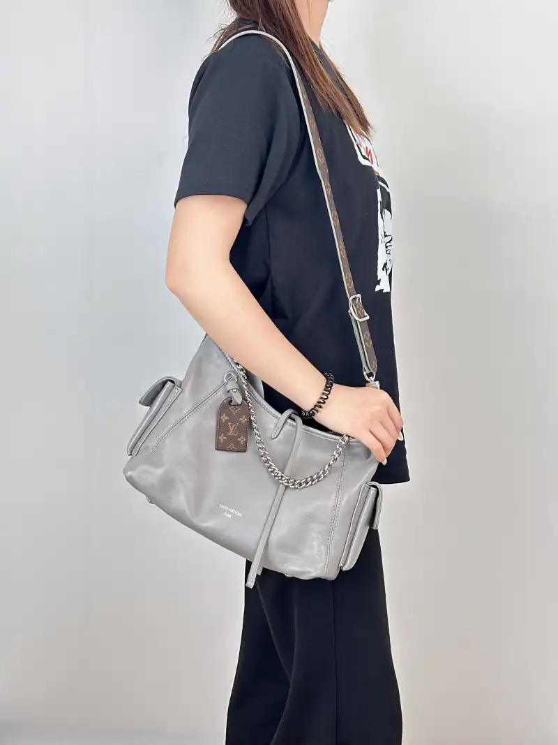 Louis Vuitton Crossbody Bag Carryall Cargo Vibe Grey SL ambskin Small 33.5 × 15 × 23 cm — on-model view 2 of 2
