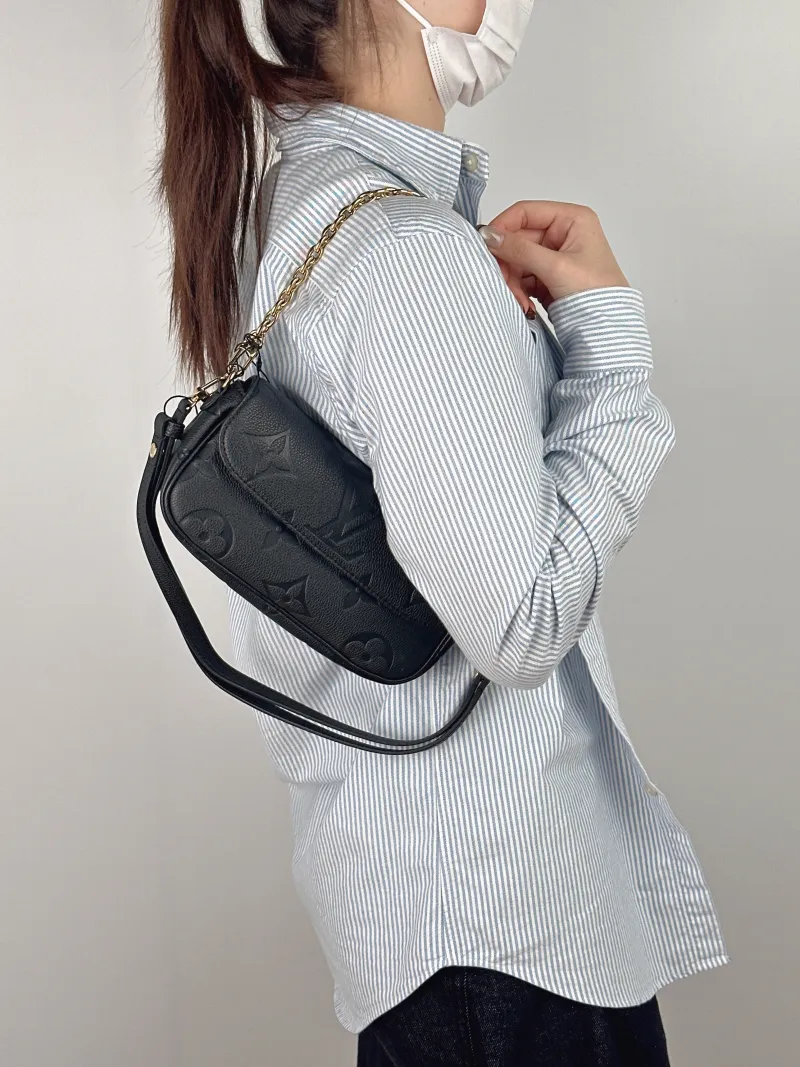 Louis Vuitton Crossbody Bag IVY Black Empreinte Embossed Calfskin Small 23.5 × 4.3 × 12 cm — on-model view 1 of 2