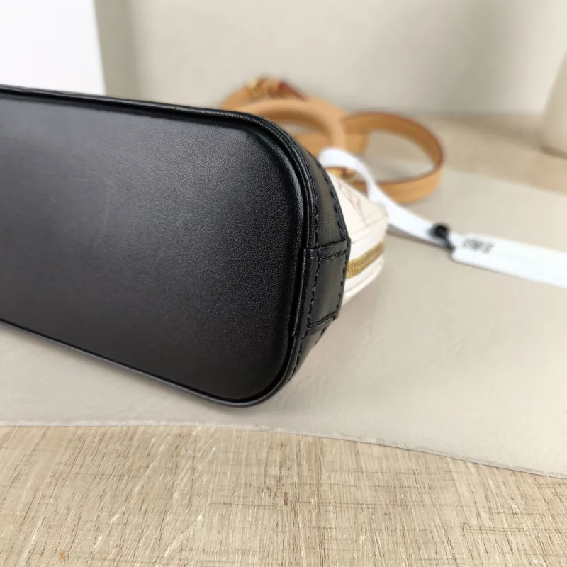 Louis Vuitton Crossbody Bag Alma Nano · Black PVC nano 18 × 8 × 12 cm — detail view 1 of 9