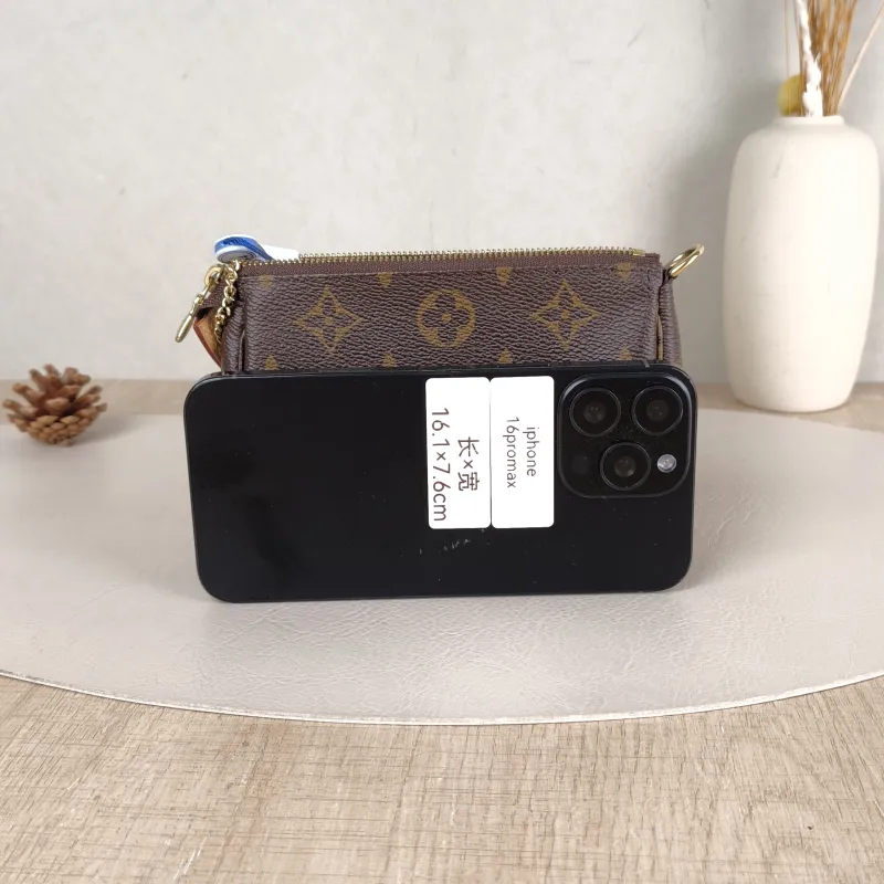 Louis Vuitton Clutch Mini Pochette Accessoires Monogram PVC Mini 15.5 × 4 × 10.5 cm — cover view 2 of 6