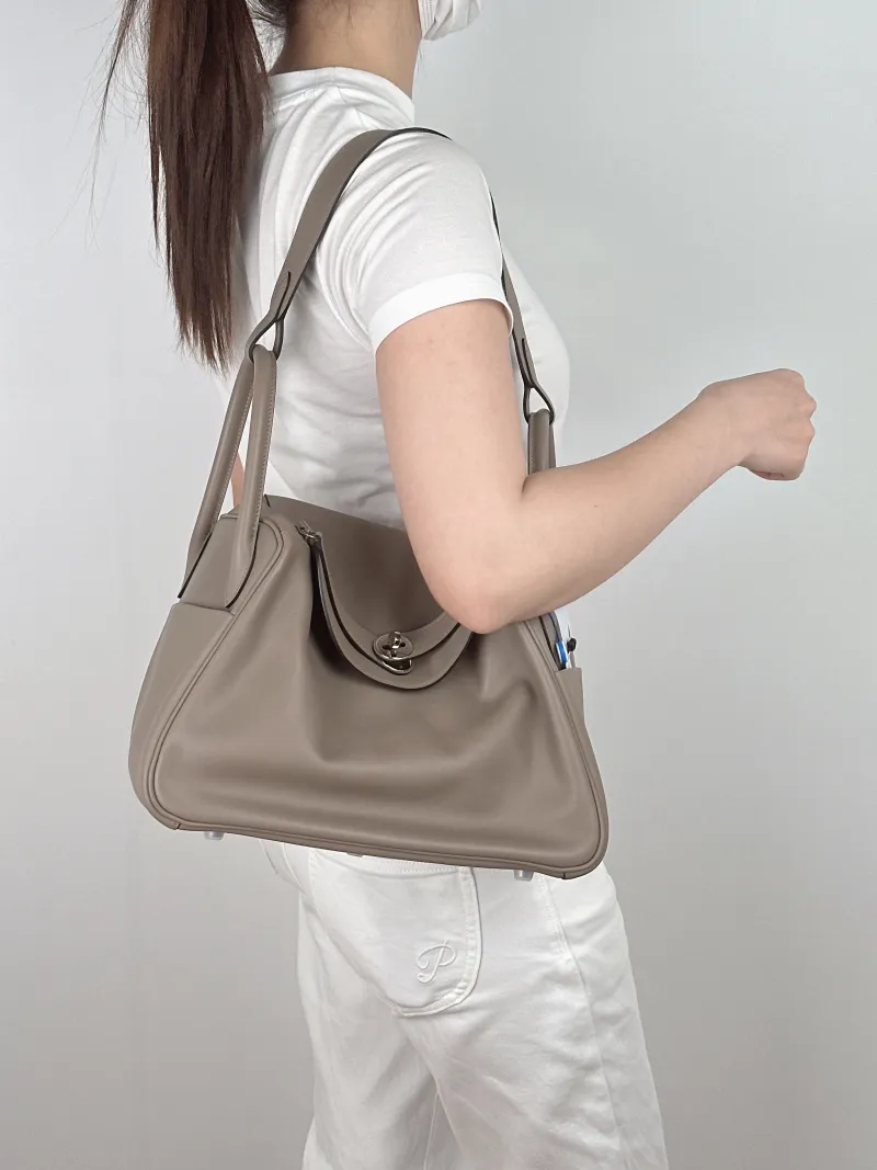 Hermès Crossbody Bag Lindy 30 Grey Blue Swift Calfskin30 × 15 × 19 cm — on-model view 1 of 2