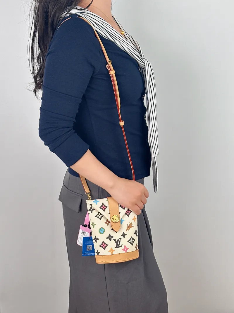 Louis Vuitton Crossbody Bag ENVELOPE POUCH Yellow PVC Mini 12.5 × 8.5 × 18 cm — on-model view 1 of 2