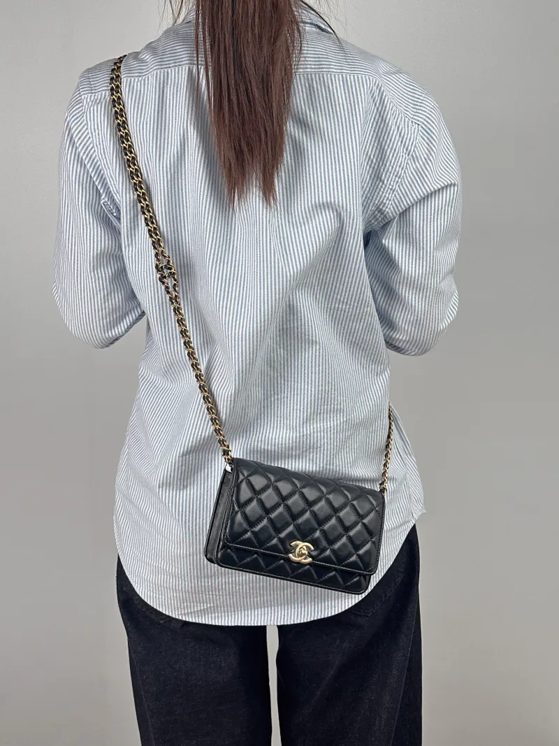 Chanel Shoulder Bag cf Black Lambskin 19 × 4.5 × 12 cm Microchip Edition — on-model view 1 of 2