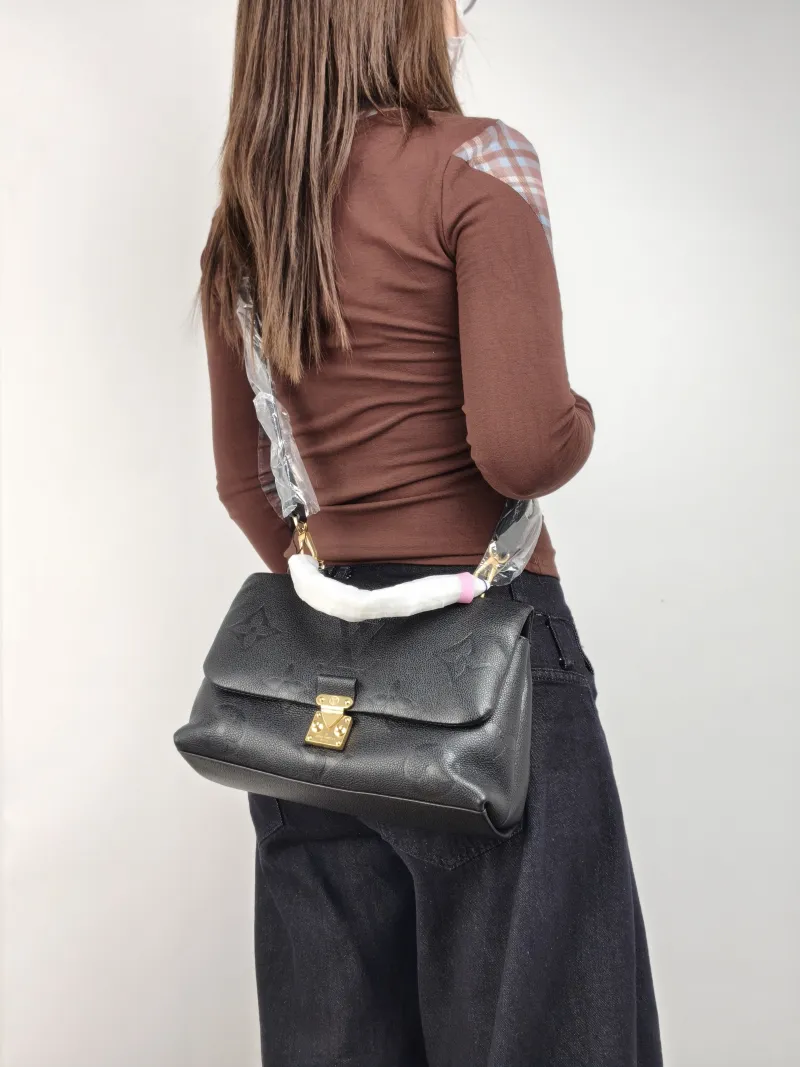 Louis Vuitton Crossbody Bag MADELEINE Black Monogram Empreinte Embossed Calfskin Medium 30 × 11 × 19.5 cm — on-model view 3 of 3