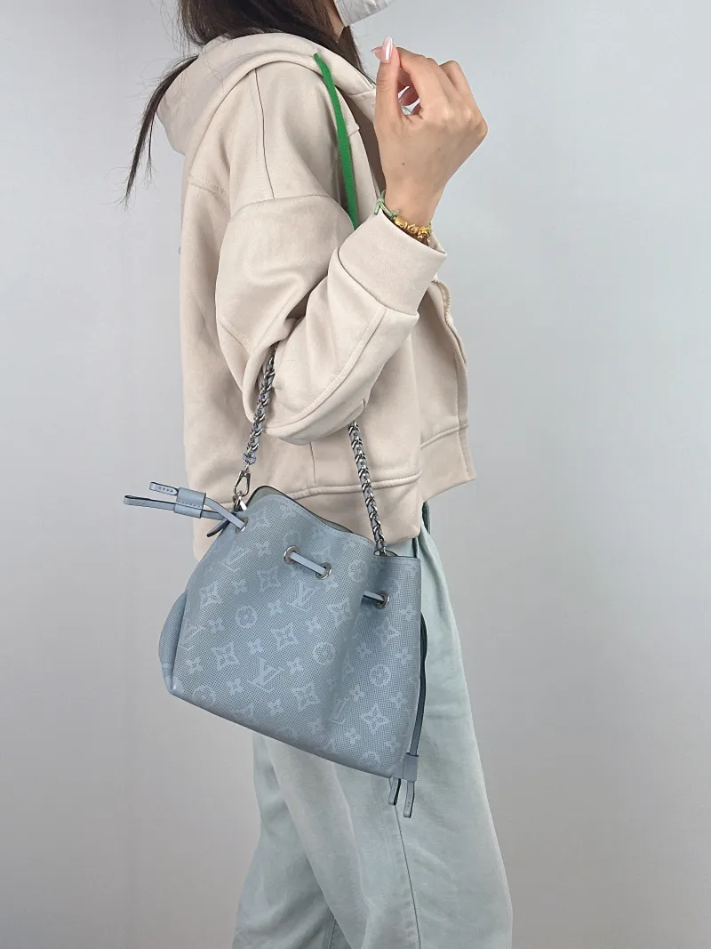 Louis Vuitton Crossbody Bag BELLA Blue Calfskin 22 × 14 × 20 cm — on-model view 1 of 3