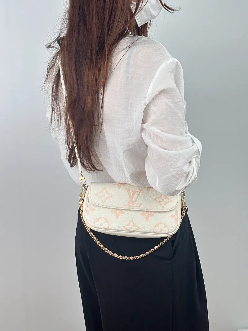 Louis Vuitton Crossbody Bag IVY White · Pink Monogram Empreinte Embossed Calfskin Small 23.5 × 4.3 × 12 cm — on-model view 1 of 2