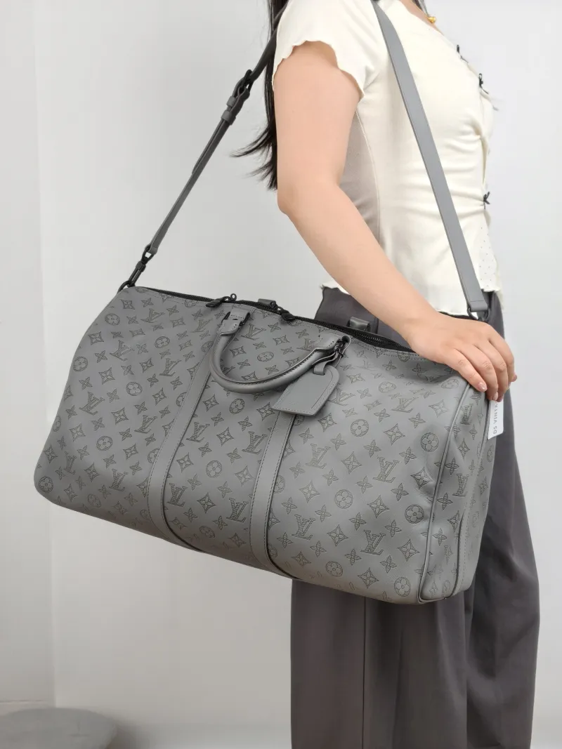 Louis Vuitton Top Handle Bag Keepall 50 Shoulder Strap Edition Grey Calfskin One Size 50 × 23 × 29 cm — on-model view 1 of 2