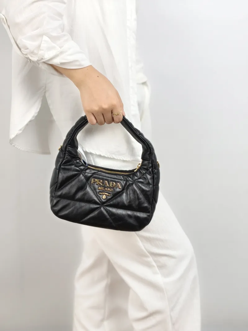 PRADA Shoulder Bag Re-Edition Black Lambskin 22 × 8 × 16 cm — on-model view 2 of 3