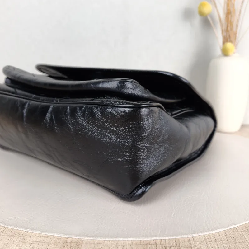 SAINT LAURENT Crossbody Bag Niki Black Waxed Leather Calfskin Medium 28 × 8.5 × 20 cm — detail view 10 of 14