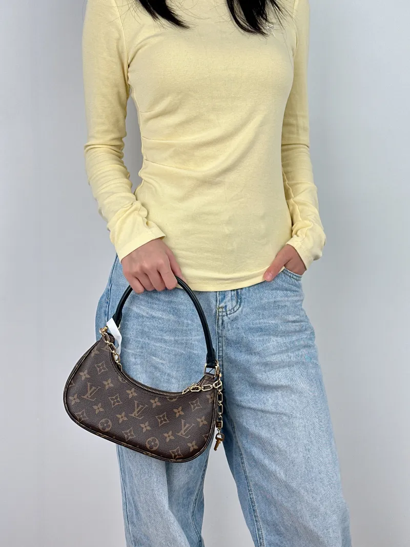 Louis Vuitton Shoulder Bag Catchy Monogram PVC Small 24 × 6 × 10 cm — on-model view 3 of 3