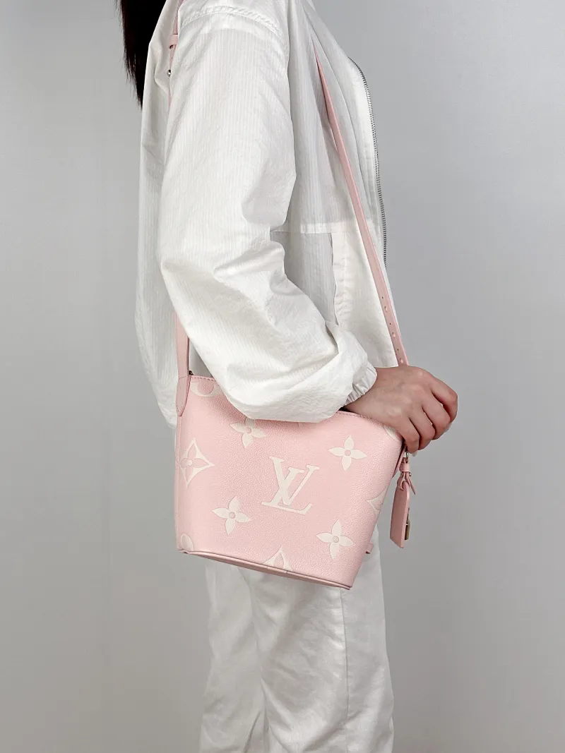 Louis Vuitton Top Handle Bag ALL IN BB · White Empreinte Embossed Calfskin Monogram BB18 × 12 × 16 cm — on-model view 1 of 2