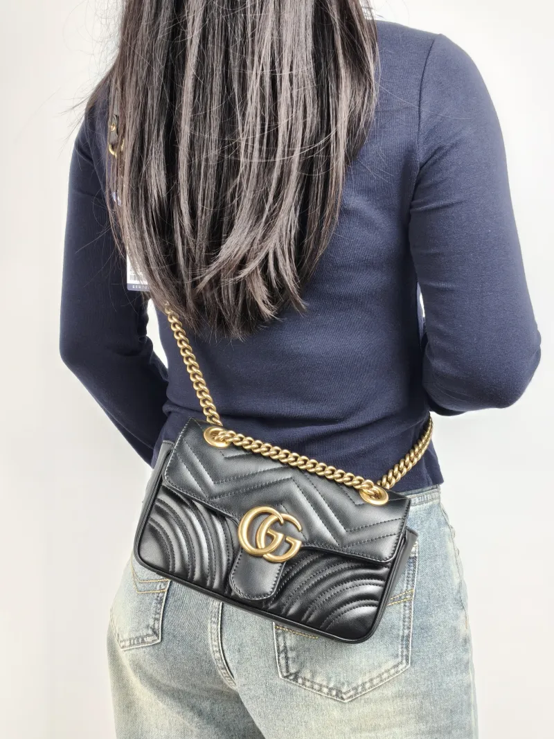 GUCCI Crossbody Bag GG Marmont Small Marmont 22 Black CC alfskin Small 22 × 6 × 13 cm — on-model view 1 of 2