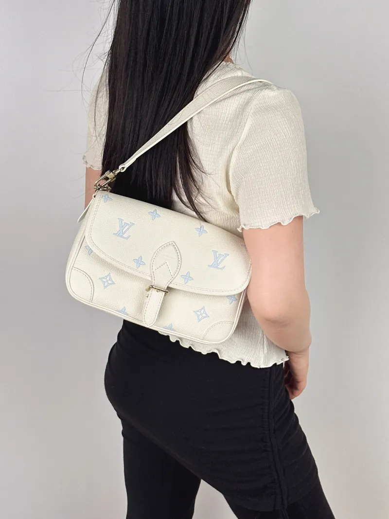 Louis Vuitton Crossbody Bag Diane Baguette Bag White · Blue Empreinte Embossed Calfskin Monogram Small24 × 9 × 15 cm — on-model view 1 of 2