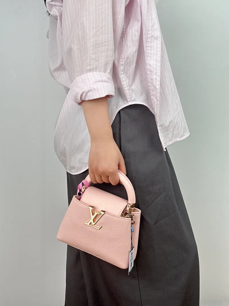 Louis Vuitton Shoulder Bag Capucines Pink Calfskin Mini 21 × 8 × 14 cm — on-model view 1 of 2