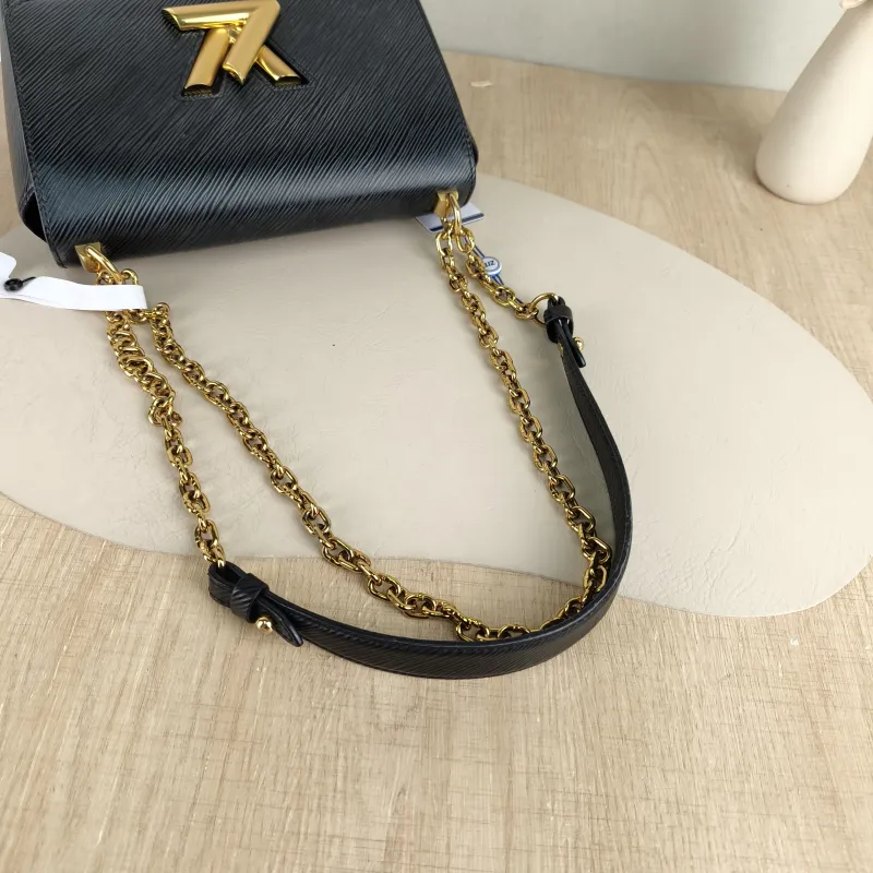 Louis Vuitton Crossbody Bag Twist Black Epi Embossed Calfskin Medium 23 × 9.5 × 17 cm — detail view 1 of 12