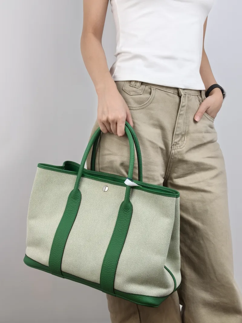 Hermès Top Handle Bag Garden Party 36 36 Beige Canvas · Calfskin Large 36 × 17 × 26 cm R — on-model view 1 of 2