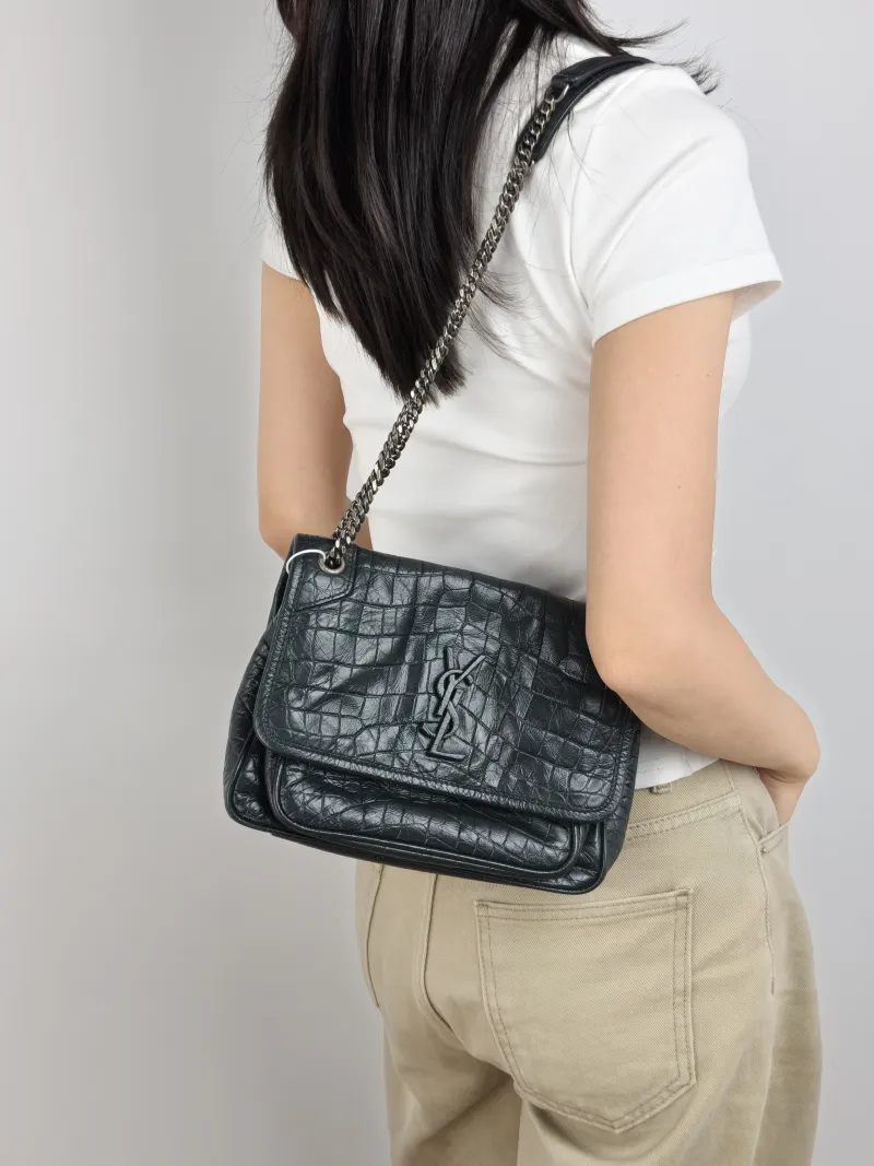 SAINT LAURENT Crossbody Bag Niki D Green Waxed Leather Small 21 × 7.5 × 16 cm — on-model view 1 of 2