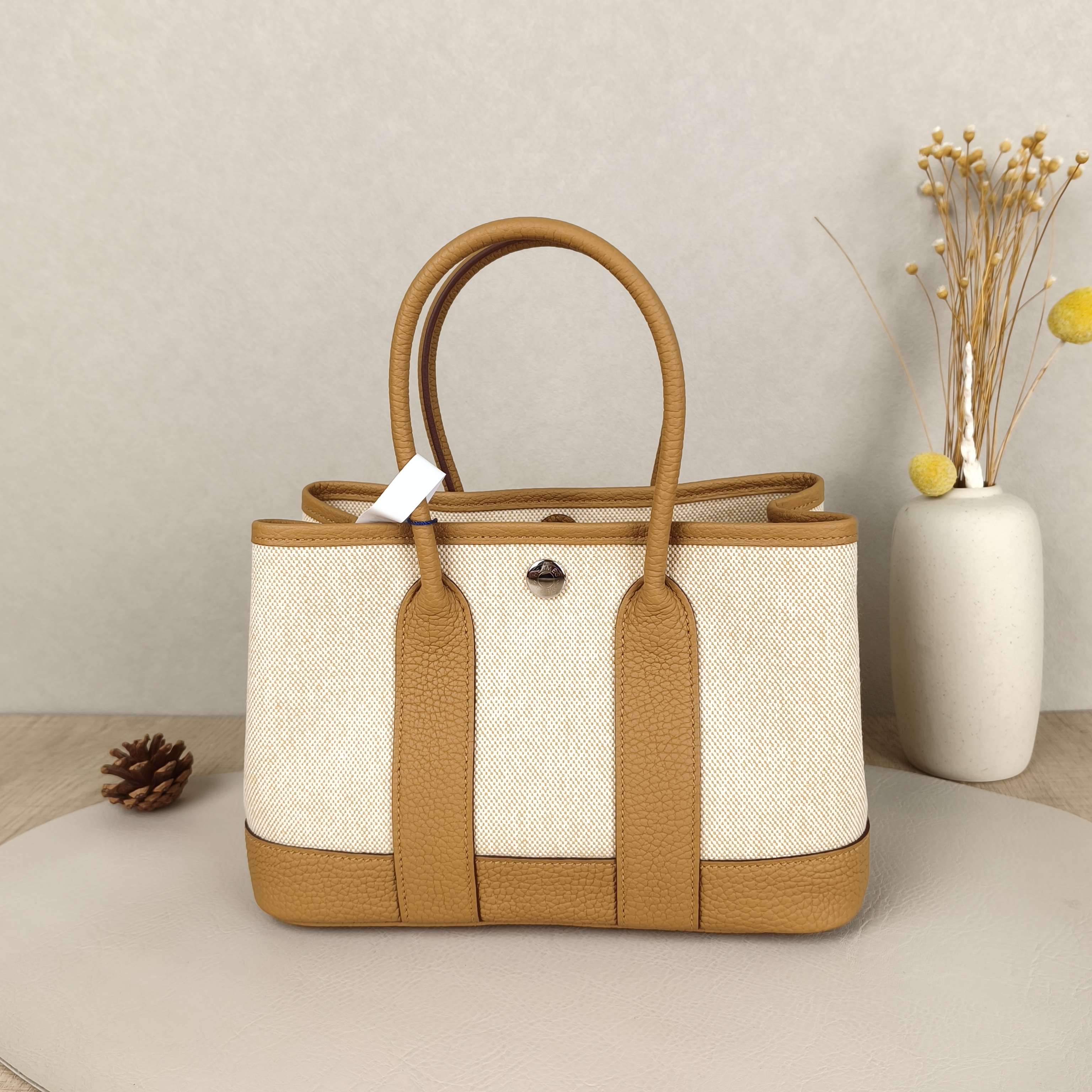 Hermès Top Handle Bag Neo Garden 23 Mini Beige2S Canvas · Negonda Calfskinmini23 × 10 × 16 cm — cover view 1 of 10