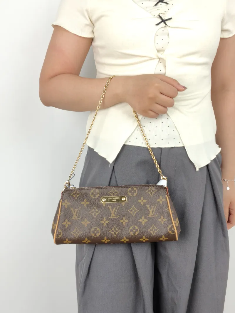 Louis Vuitton Shoulder Bag Pochette Eva Monogram PVC One Size27 × 5 × 11 cm — on-model view 1 of 2
