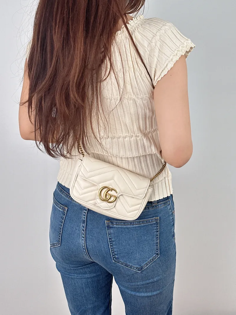 GUCCI Crossbody Bag GG Marmont Mini Marmont Mini White Calfskinmini16.5 × 4.5 × 9.5 cm — on-model view 1 of 2
