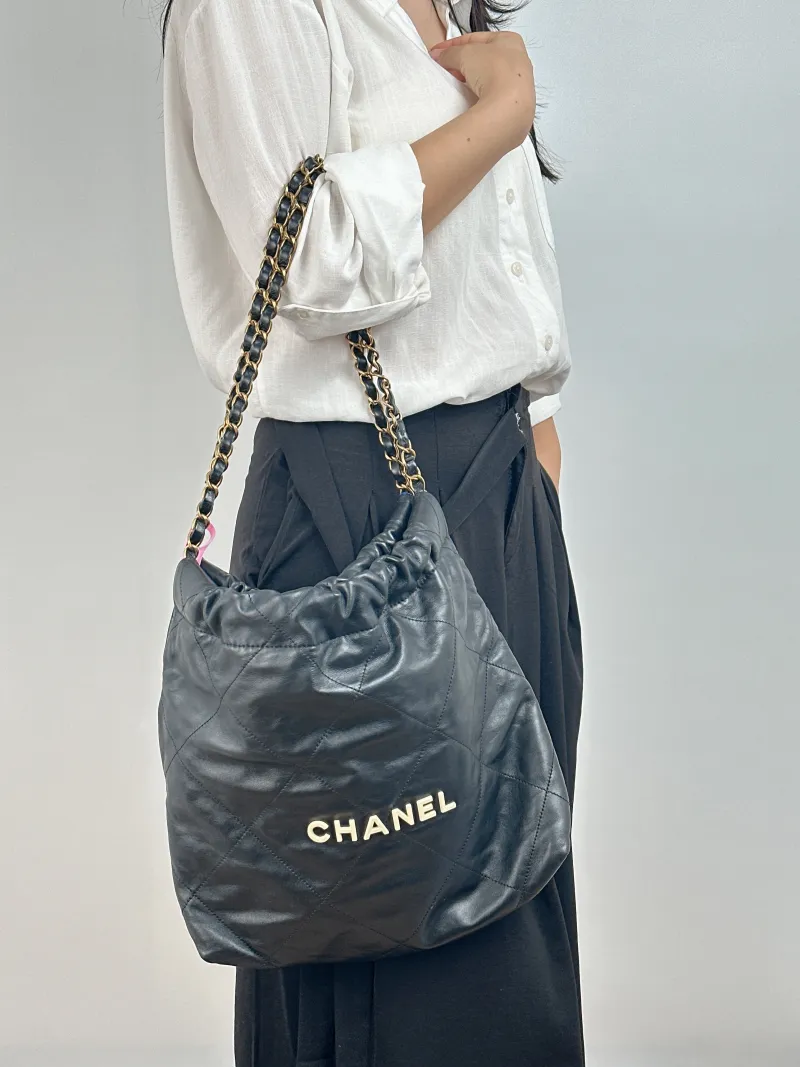 Chanel Shoulder Bag 22Bag Black CC alfskin Small 35 × 7 × 37 cm — on-model view 1 of 2